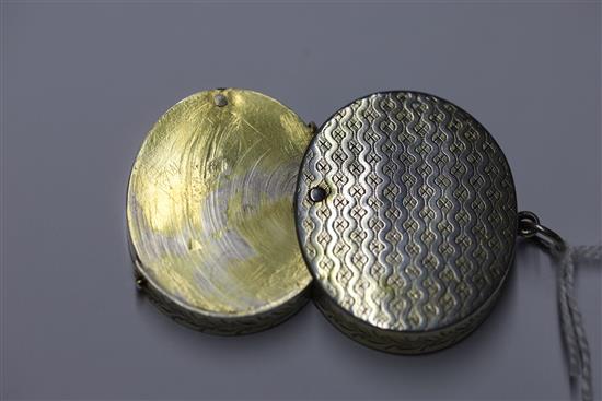 A George III engraved silver gilt oval vinaigrette by William Troby, gross 36 grams.